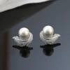 The new S925 silver-needle studded zircon feather pearl stud earrings feature a high-end design and are a light luxury French retro earring accessory details Picture
